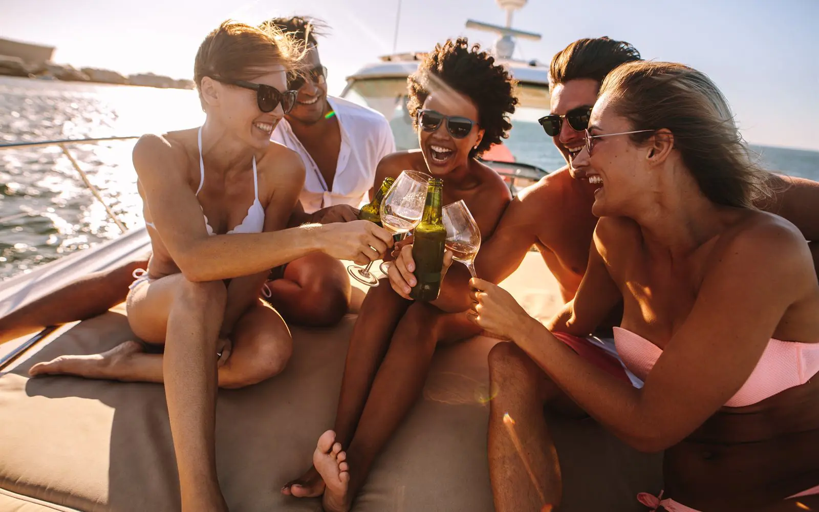 Members sharing drinks on a yacht